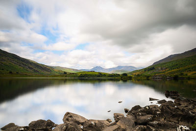 Scenic view of lake and mountains against sky