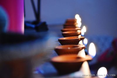 Close-up of tea light candles on table