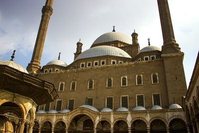 Low angle view of mosque against sky