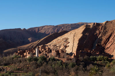 Scenic view of mountains against clear blue sky