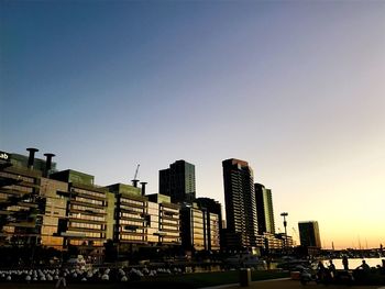 Skyscrapers in city against clear sky