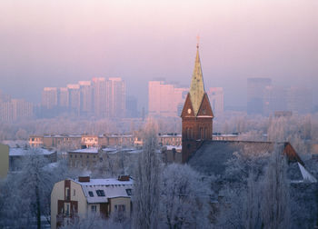 Cityscape against sky during winter