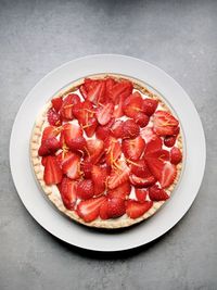 High angle view of chopped fruits in plate on table