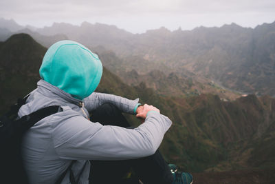 Traveler enjoying moment above huge mountain ranges on santo antao island, cape verde