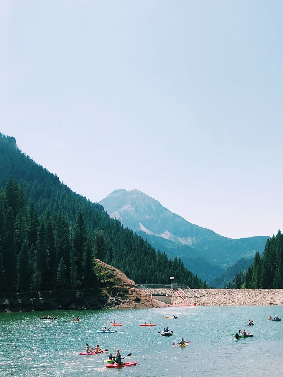 water, mountain, group of people, nautical vessel, real people, sky, scenics - nature, beauty in nature, transportation, day, leisure activity, nature, large group of people, crowd, tree, lifestyles, men, mode of transportation, plant, mountain range, outdoors
