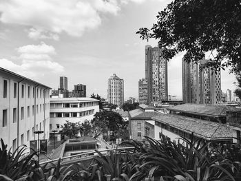 Modern buildings in city against sky