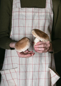 High angle view of woman holding coffee cup