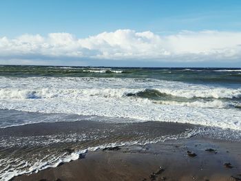 Scenic view of beach against sky