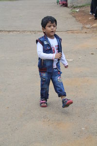 Full length of boy standing outdoors