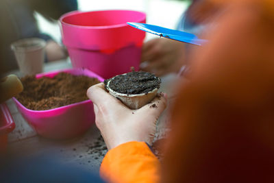 Close-up of hand holding ice cream