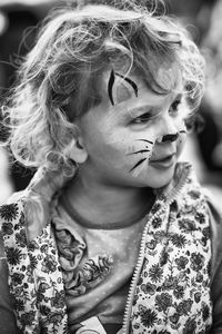 Close-up of girl with animal face paint