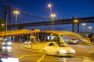 Illuminated light trails on road at night