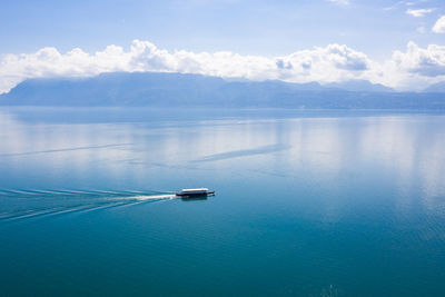 Sailboat in sea against sky