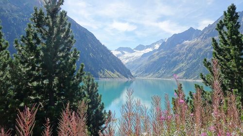 Scenic view of lake and mountains against sky