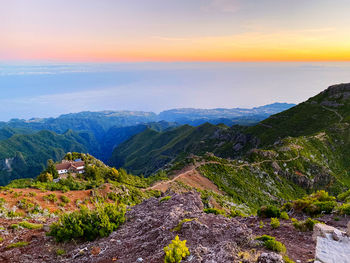 Scenic view of mountains against sky during sunset