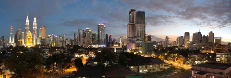 View of skyscrapers lit up at night