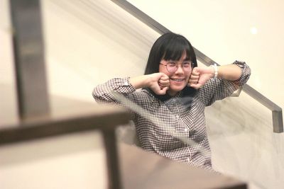 Portrait of smiling young woman at home