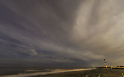 Road against sky at night