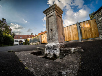 View of old building against cloudy sky