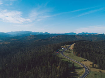 High angle view of road amidst plants against sky