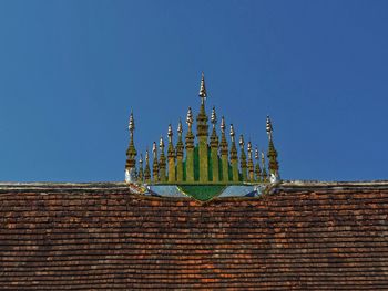 Low angle view of traditional building against clear blue sky