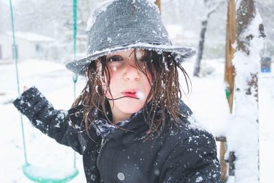 Close-up portrait of girl wearing hat during winter