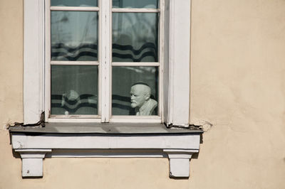 Low angle view of white window on building