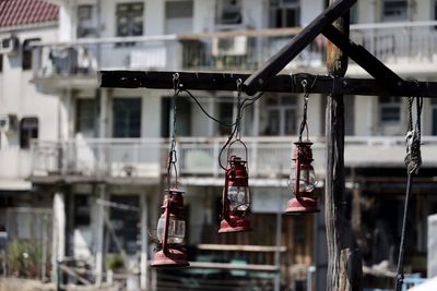 Close-up of electric lamp hanging in building