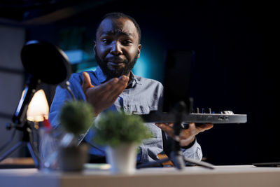 Low angle view of man playing drum