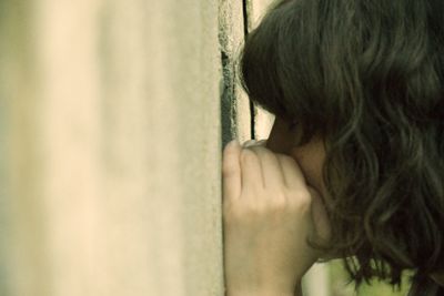 Rear view of woman with hand in hair