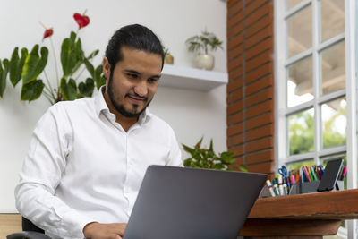 Young man using mobile phone