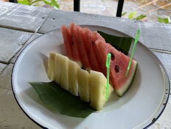 High angle view of fruits in plate on table