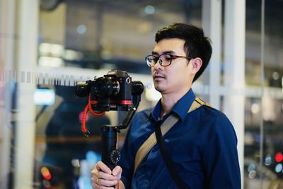 Young man photographing