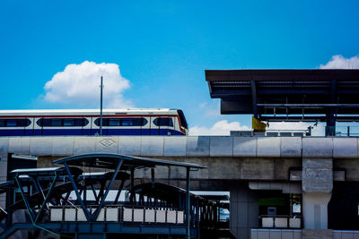 Low angle view of bridge against blue sky