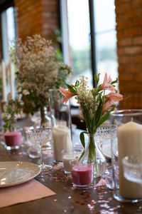 Flower vase on table in restaurant