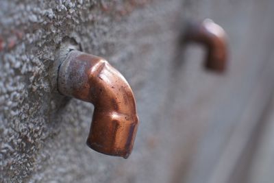 Close-up of padlock on metal door