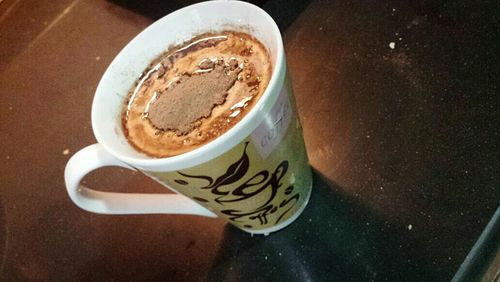 Close-up of coffee cup on table