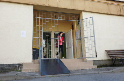 Man standing by building