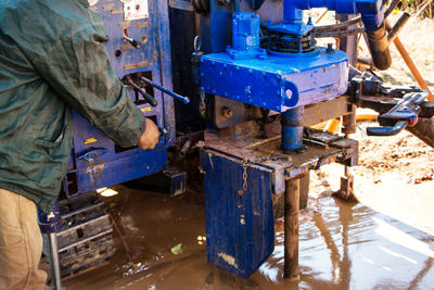 Low angle view of man working at construction site