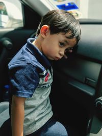 Boy sitting in car