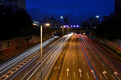 High angle view of light trails on road at night