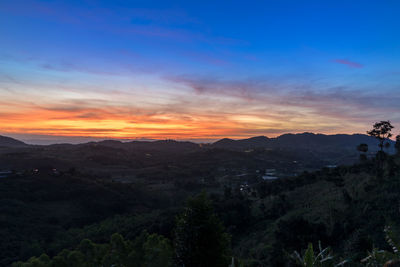 Scenic view of mountains against sky during sunset