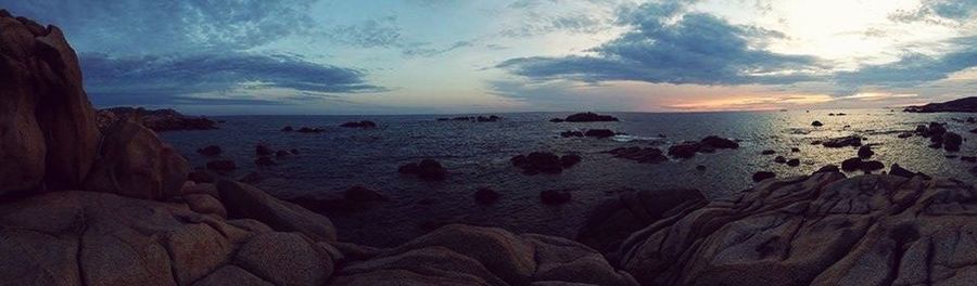 Scenic view of sea against cloudy sky