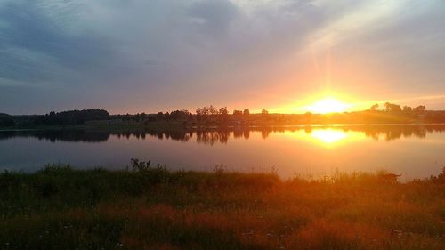 Scenic view of lake against sky during sunset