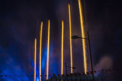 Low angle view of illuminated built structure at night