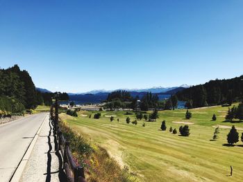 Panoramic view of landscape against clear blue sky