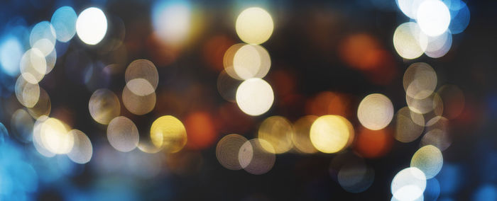 Defocused image of illuminated lights at night