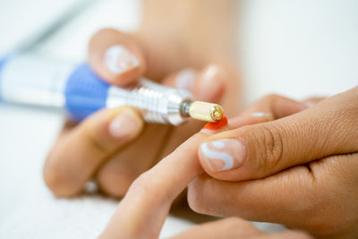 Close-up of woman holding hands