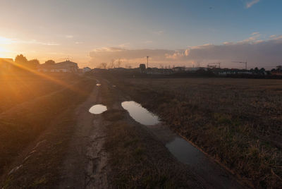 Scenic view of field against sky during sunset