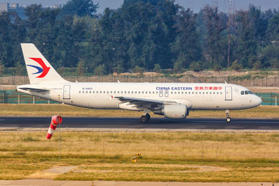 Side view of a airplane on runway